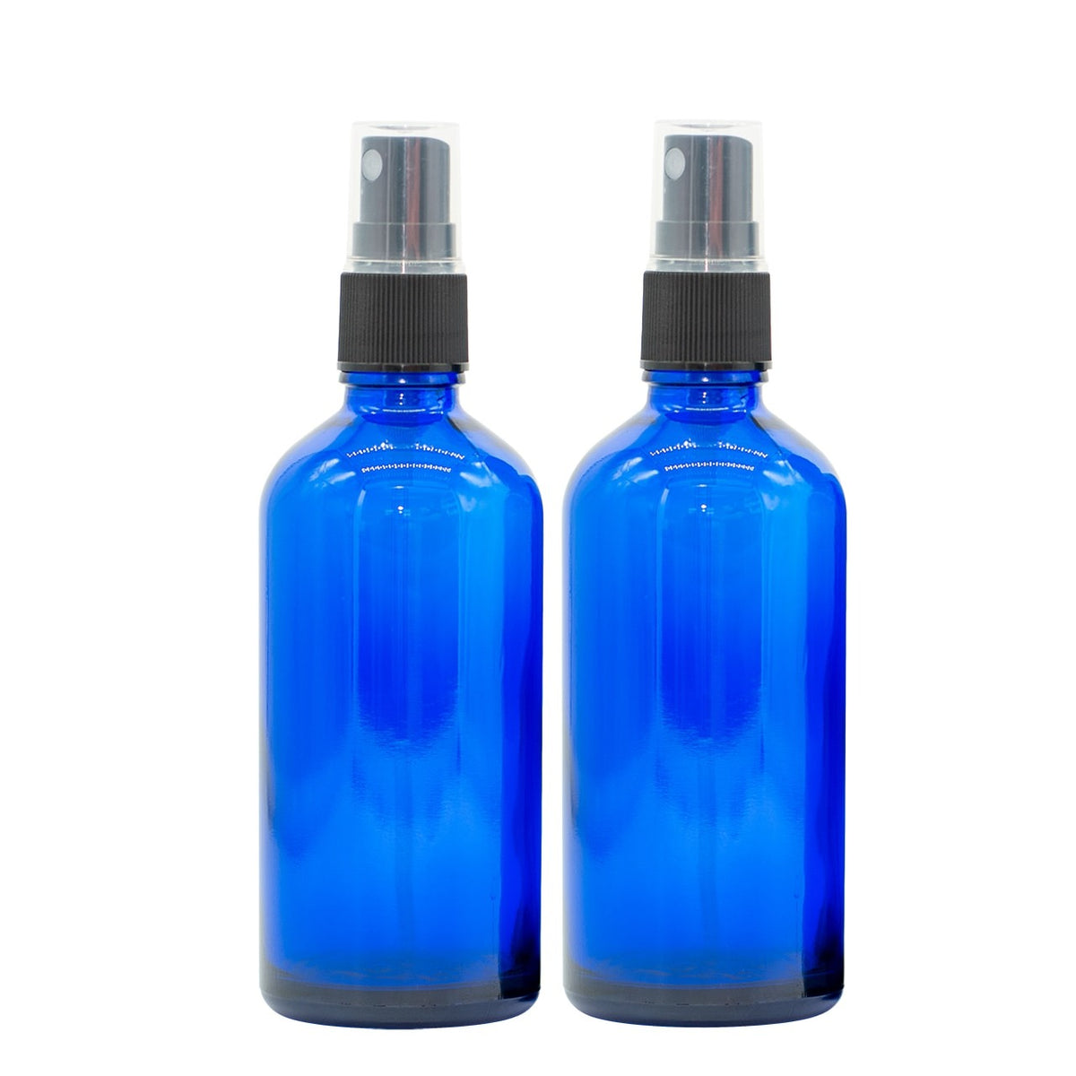 Two 100 ml blue glass spray bottles with black spray tops, suitable for essential oils.