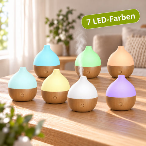 Kompakter Aroma USB Diffuser mit LED, 100 ml, in verschiedenen Farben und Holzoptik, zeigt sieben leuchtende Farben.