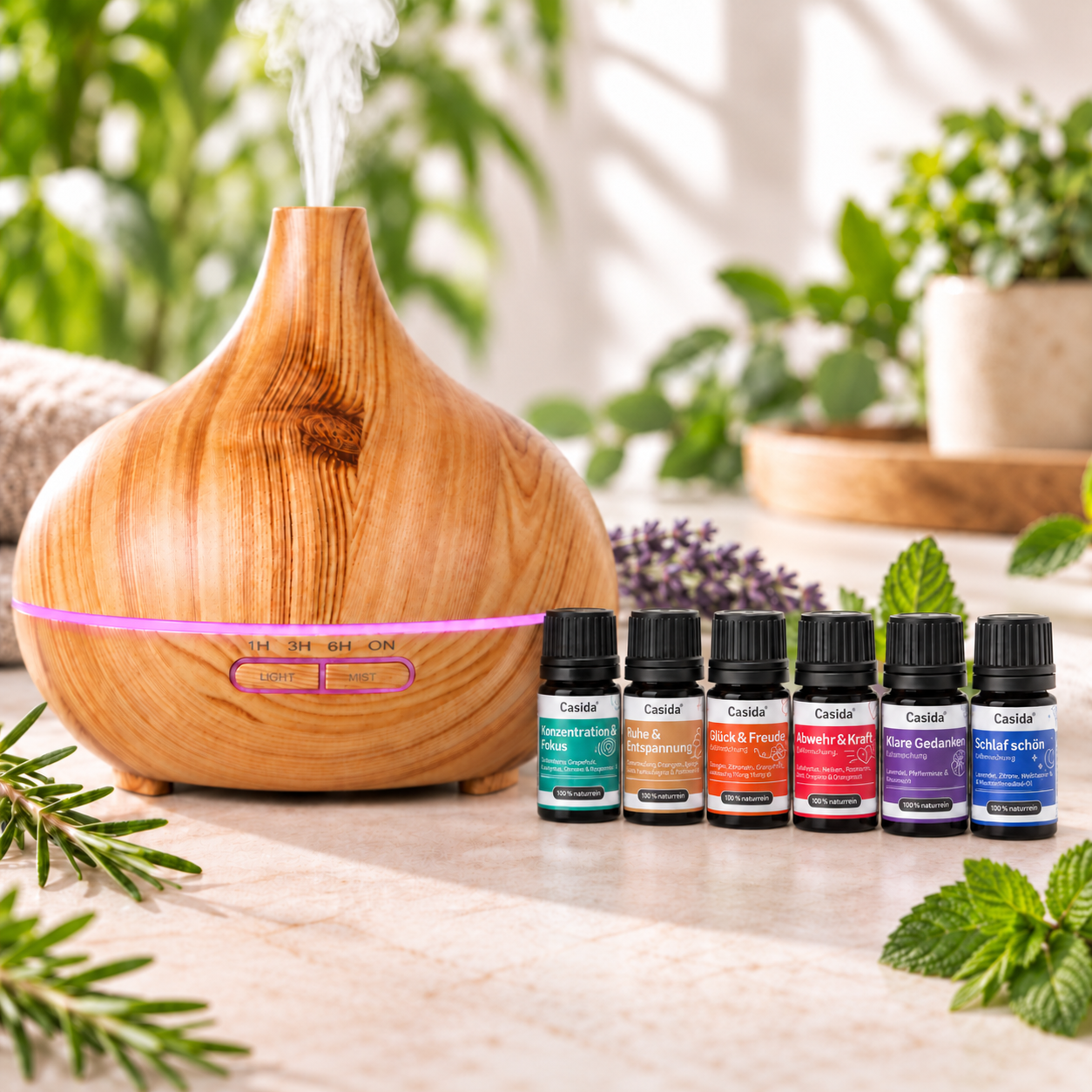 Casida Aroma Diffuser in Holzoptik mit rosa LED-Licht und sechs Duftmischungen auf einem Tisch