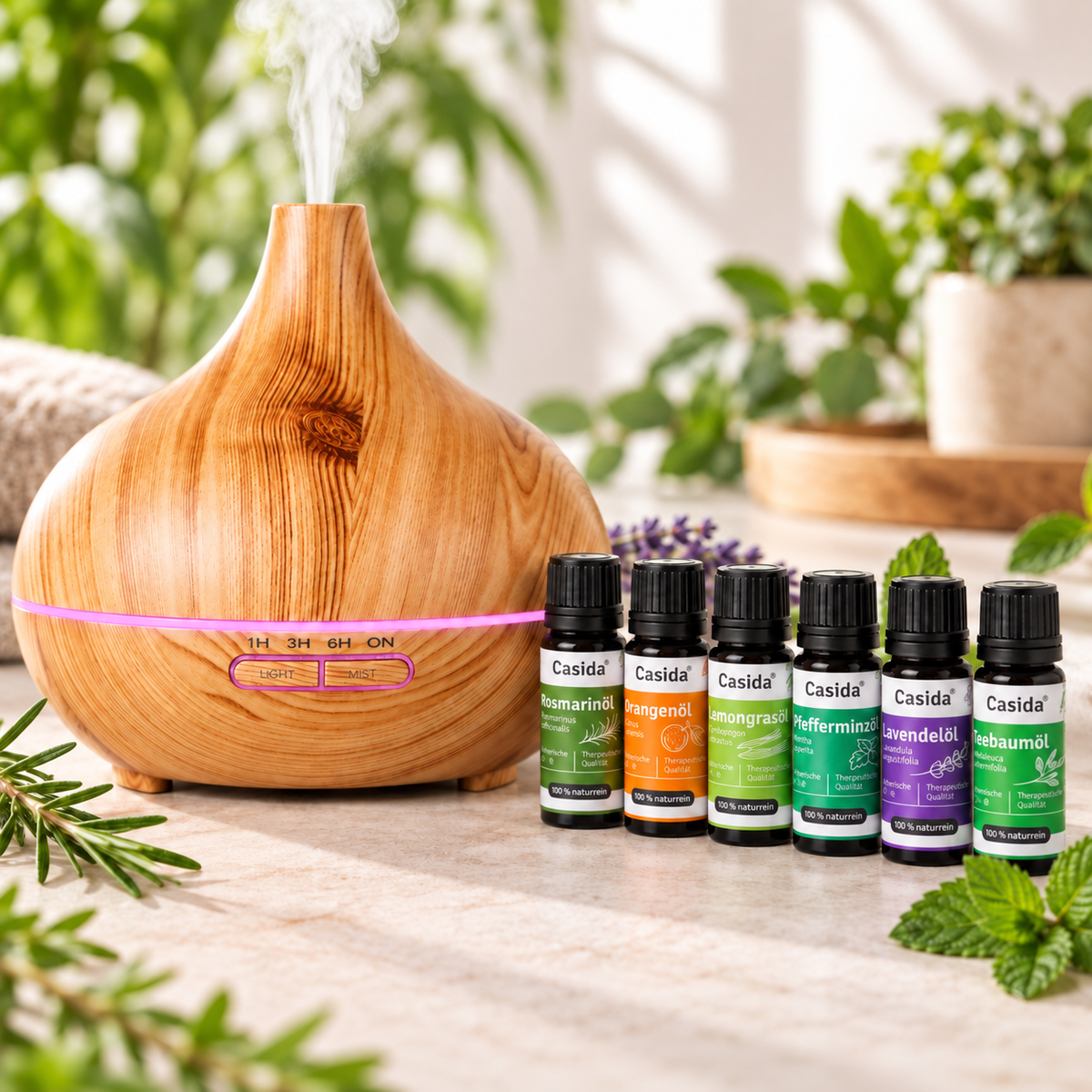 Casida Aroma Diffuser in Holzoptik mit rosa LED-Licht und sechs ätherischen Ölen auf einem Tisch
