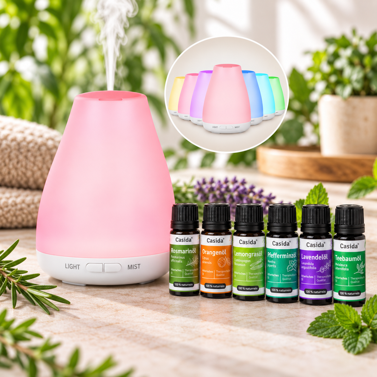 Casida Starter Aroma Diffuser mit rosa LED-Licht und sechs ätherischen Ölen auf einem Tisch