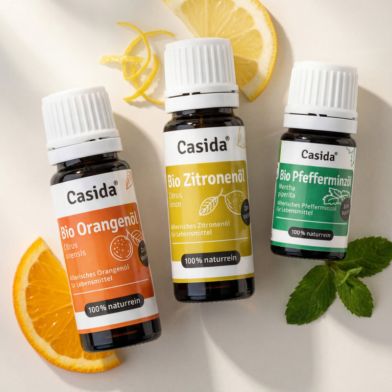 Top 6 organic essential oils for cooking, featuring orange, lemon, and peppermint oils in dark glass bottles.