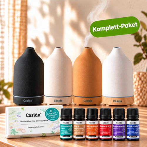 Keramik Aroma Diffuser set with three diffusers in black, white, and beige, plus six essential oil bottles and a card.
