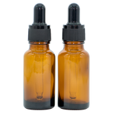 Two 20 ml brown glass dropper bottles with black caps, suitable for essential oils.
