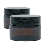 Braun Glas Tiegel Set mit zwei 30 ml Behältern, jeweils mit schwarzem Deckel.