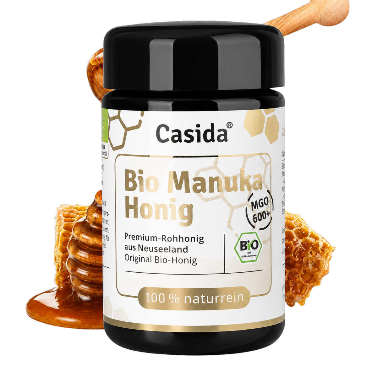 Casida Bio Manuka Honig MGO 600+ in a black jar with a honey dipper and honeycomb background.