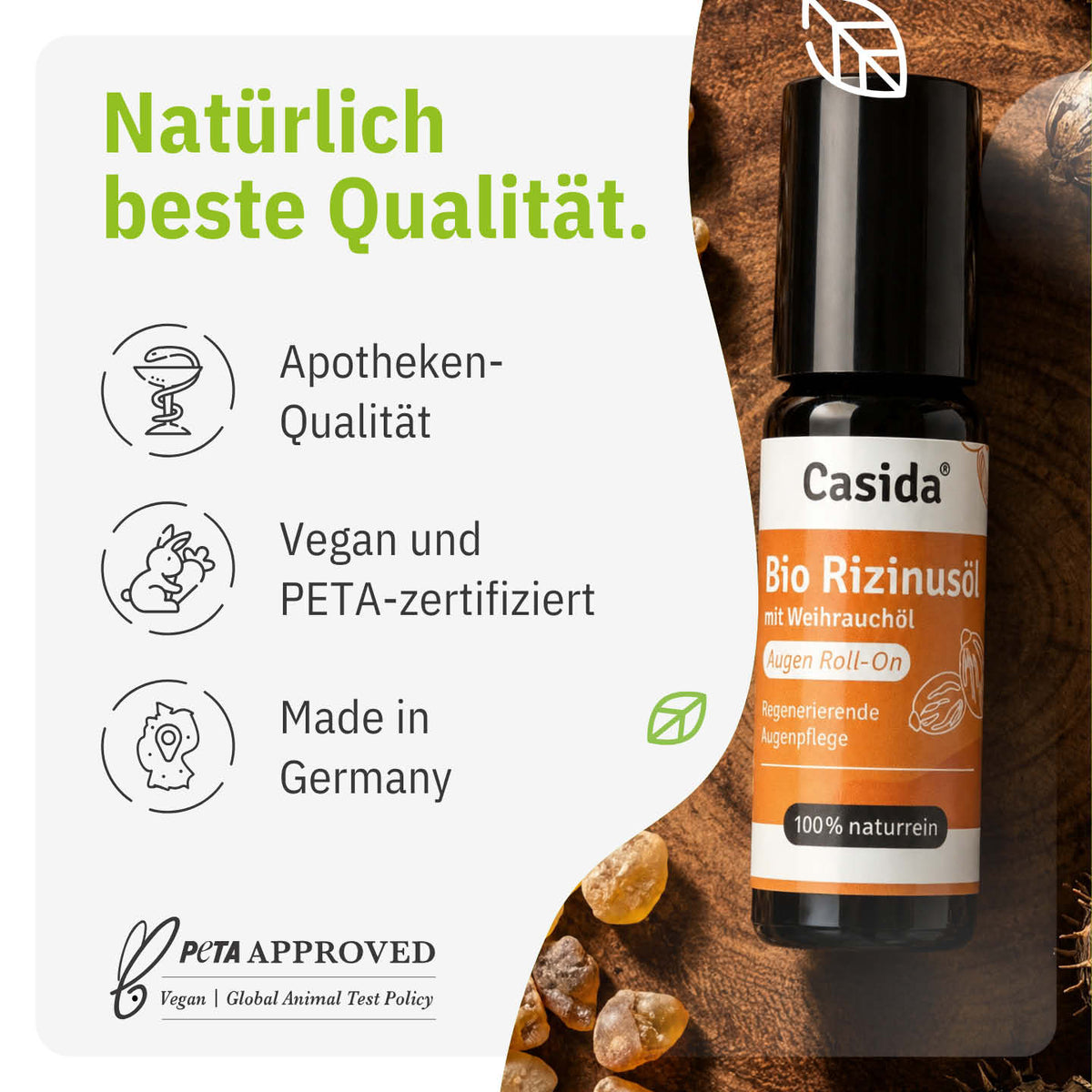 Bio castor oil roll-on with frankincense oil, featuring a black bottle and orange label, placed on a wooden surface.
