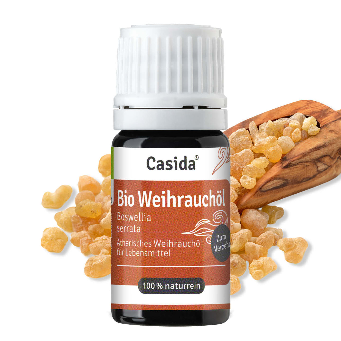 Casida Bio Weihrauchöl in dunkler Flasche neben Weihrauchharz und einem Holzlöffel