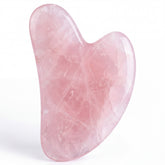 Casida wellness set includes a heart-shaped rose quartz gua sha tool with smooth, polished surfaces.
