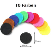 Filz Pads in 10 colors, each 20 mm in diameter, arranged in a fan shape with a black pad at the bottom.