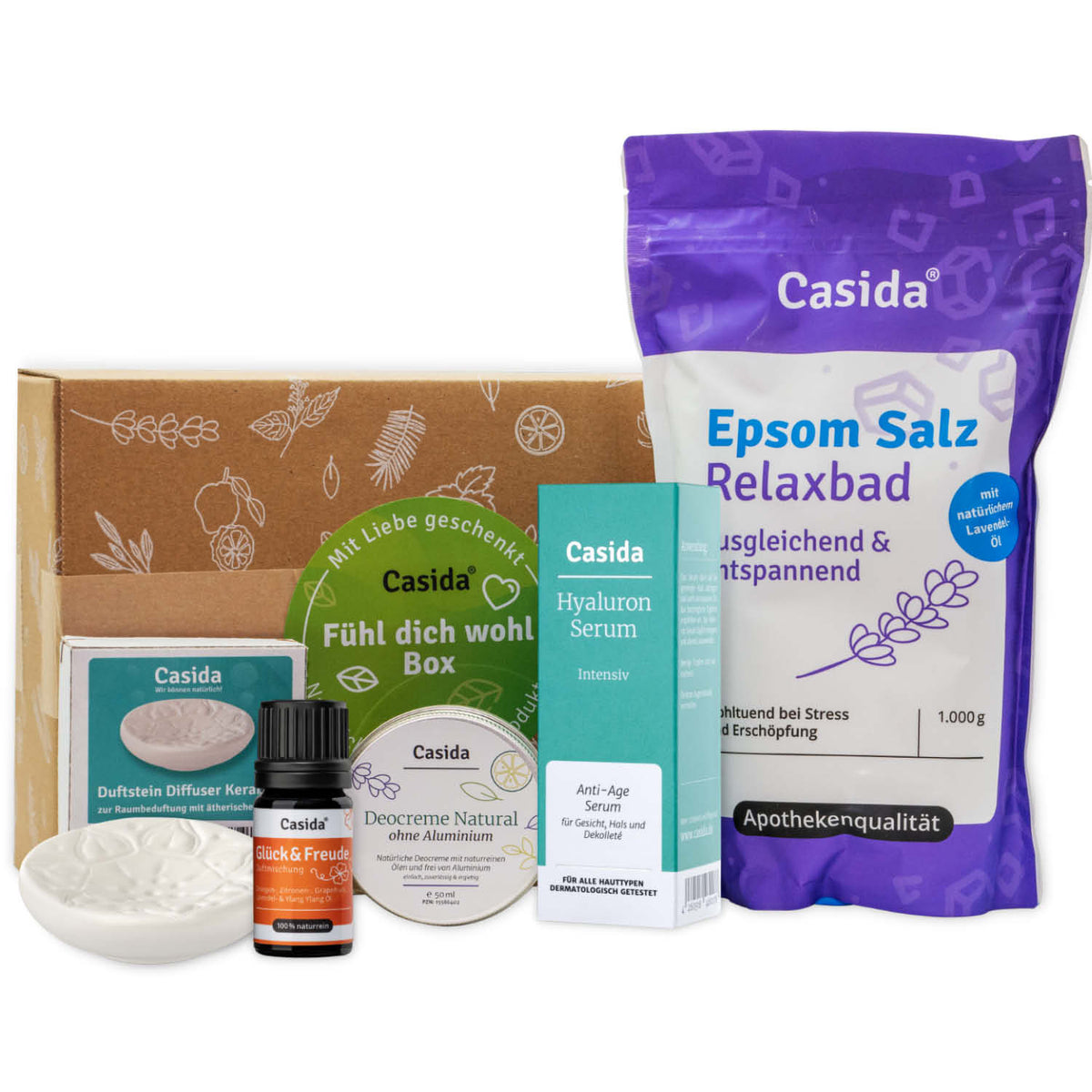 Casida Geschenkbox: Fühl Dich Wohl-Box featuring wellness products, including serum, bath salts, and diffuser.
