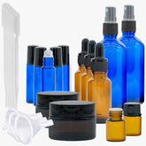 Aromatherapie Profi Set with various blue and brown glass bottles, including spray and roll-on containers, and jars.