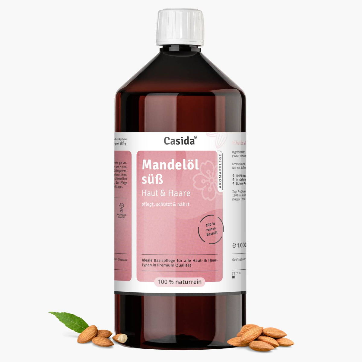 Mandelöl Haut und Haare in a 1-liter bottle, featuring a white label with pink accents and almonds scattered around.
