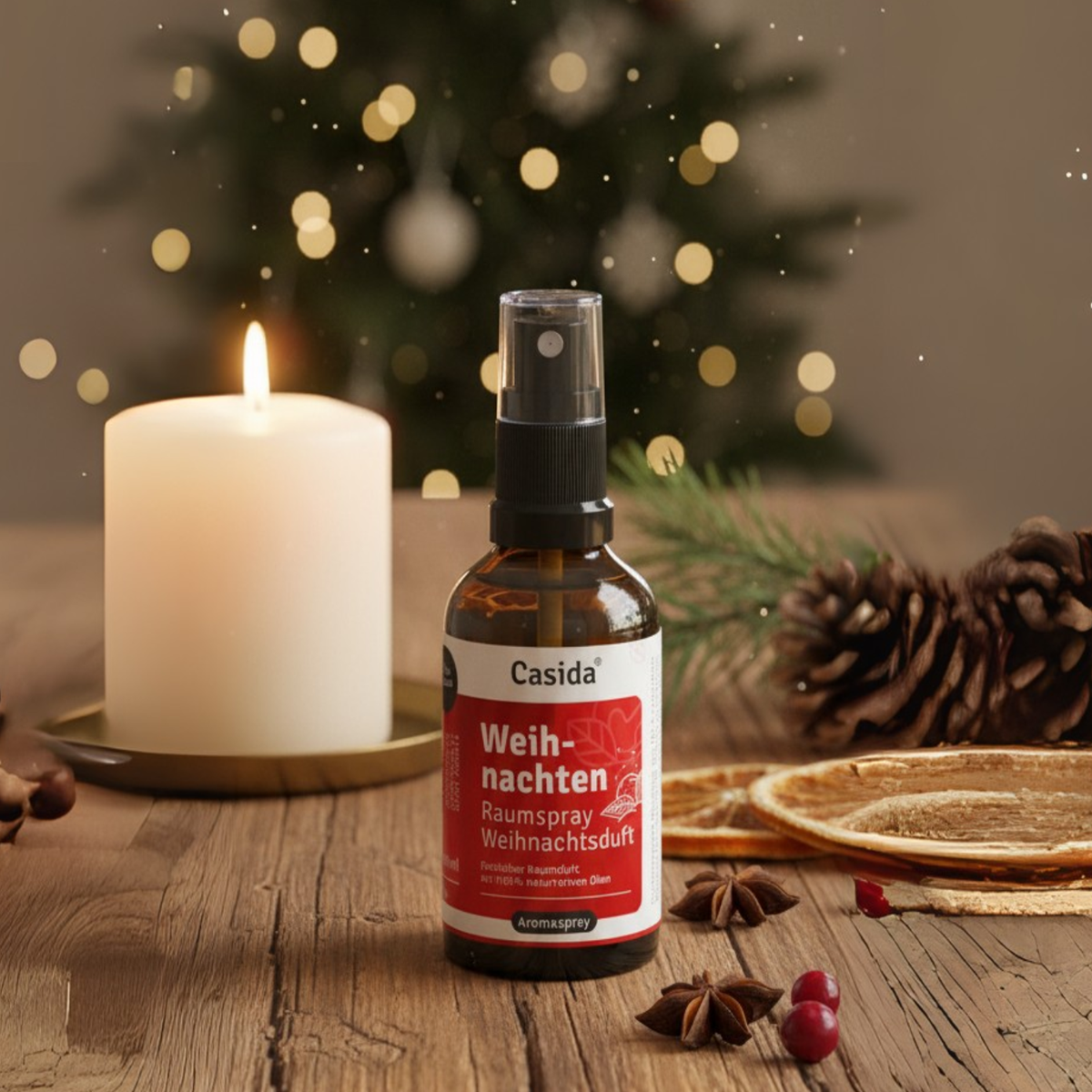 Weihnachten raumspray in a brown bottle, placed on a wooden surface with a candle and festive decorations.