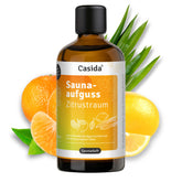 Saunaaufguss Zitrustraum oil bottle with citrus fruits, featuring orange and lemon, on a white background.