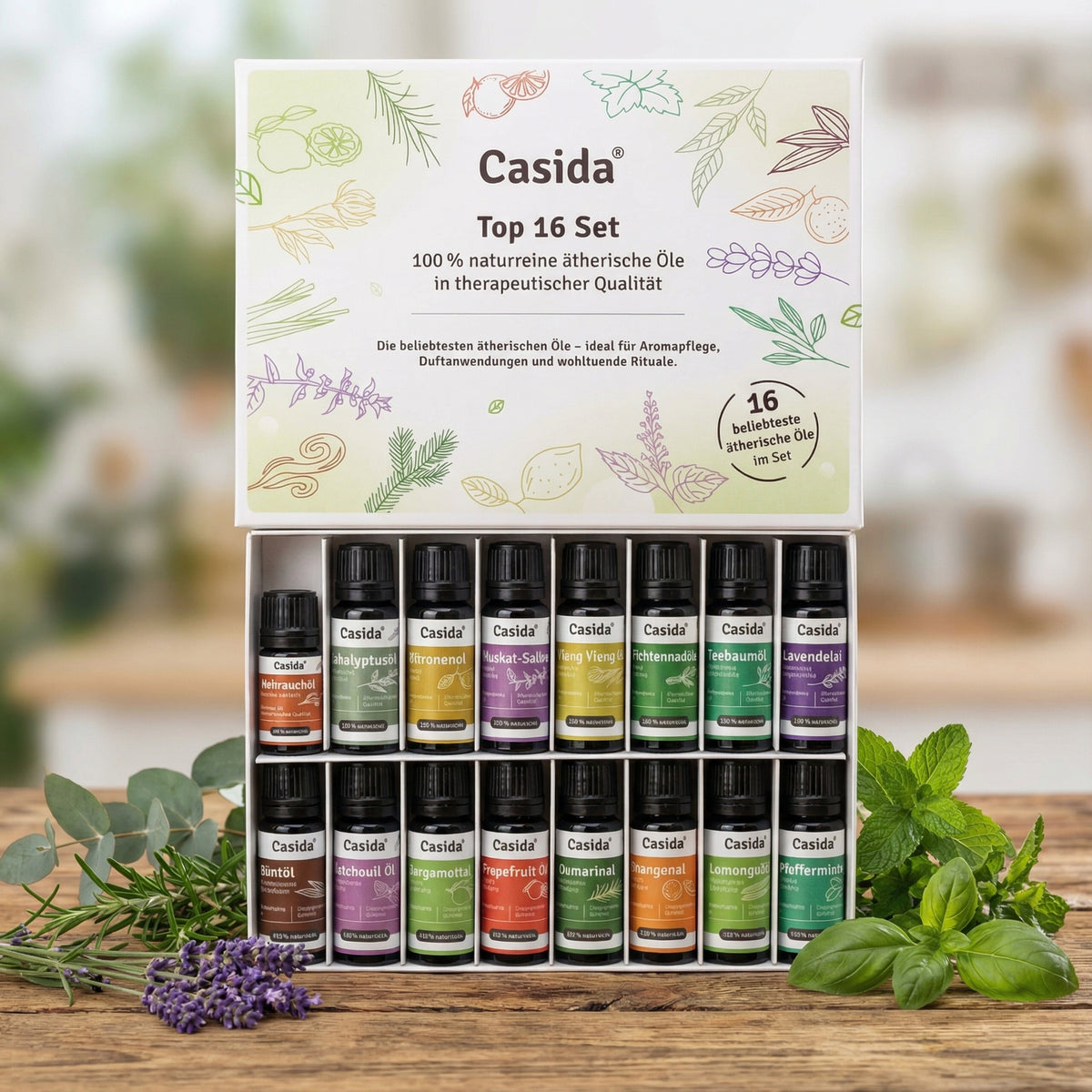 Casida top 16 essential oils set in a box, featuring various colored bottles and herbal illustrations on the packaging.