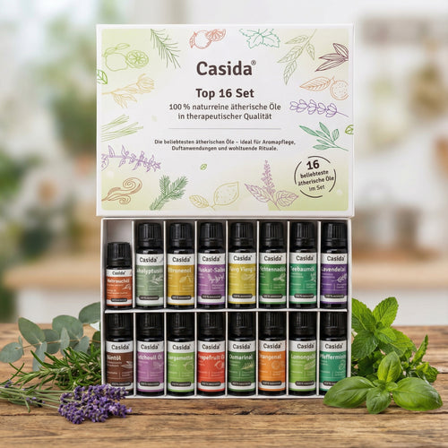 Casida top 16 essential oils set in a box, featuring various colored bottles and herbal illustrations on the packaging.