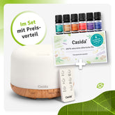 Aroma diffuser with remote control, 500 ml capacity, and six essential oil blends in a set.