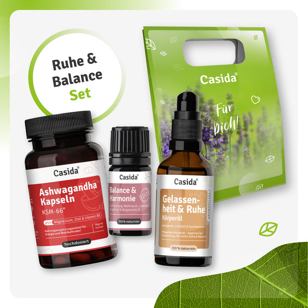 Ruhe & Balance set featuring Ashwagandha capsules, essential oil, and body oil in a green gift bag.